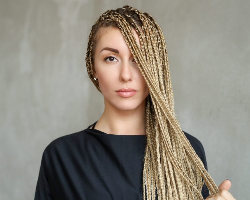 Hairstyle and fashion. Woman with dreadlocks